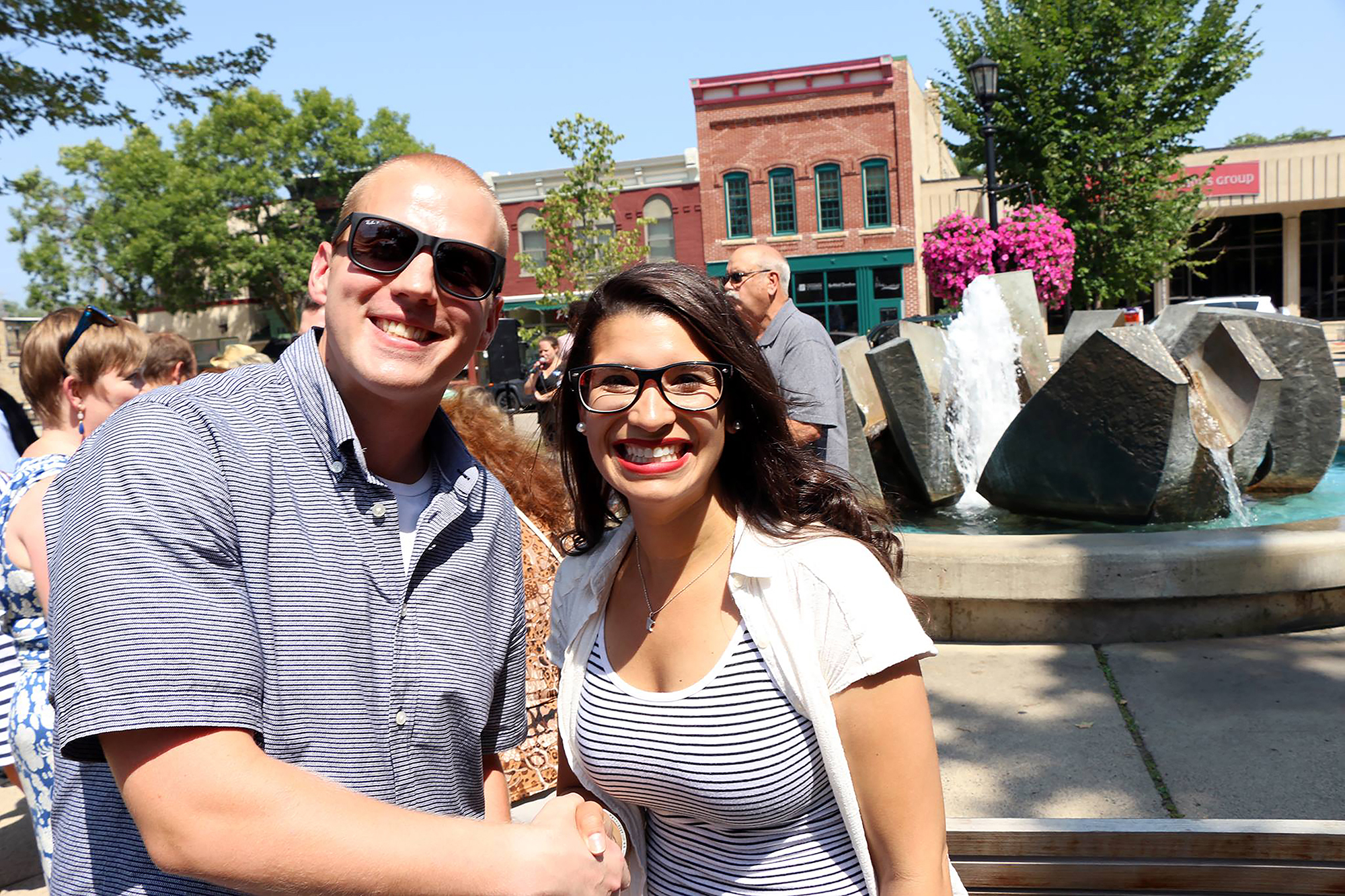 public arts commission Founder stephen dewyer handshakes with Erin Maye Quade in front of public art in Northfield, Minnesota on 13 August 2018